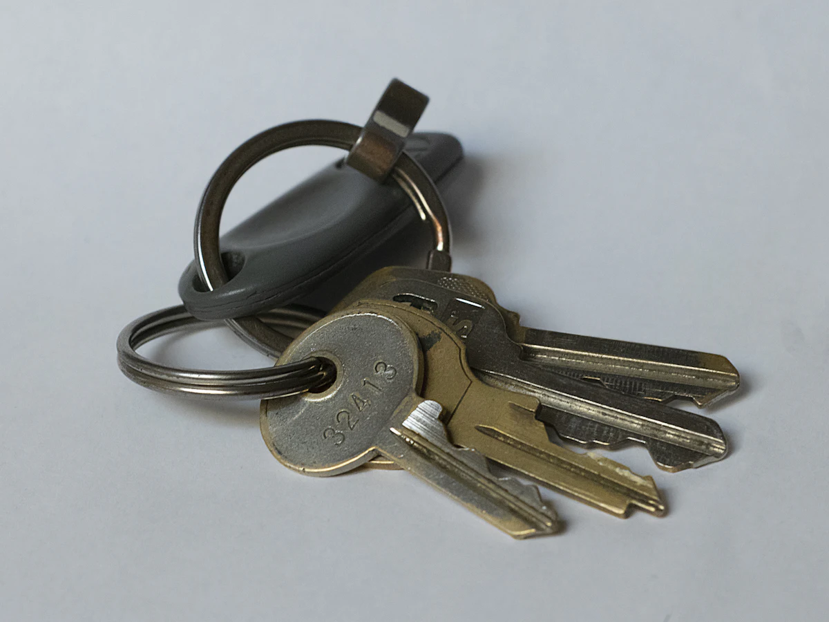 A set of car keys with a fleet tag, ready for a first rental